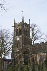 Fototapeta na wymiar Detail of a typical English church showing clock tower