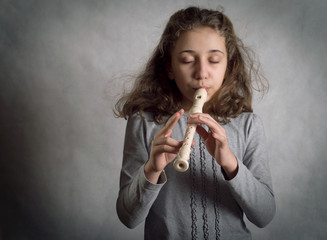 Girl Playing Flute © aboikis