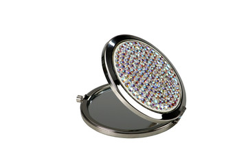 Round pocket makeup mirror with stones on white background