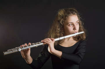 Girl Playing Flute © aboikis