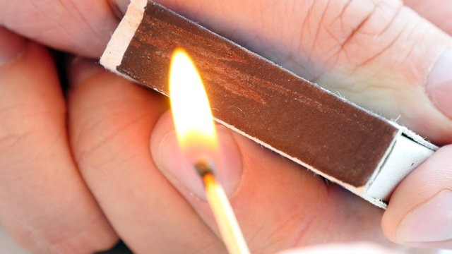 Man lights a match