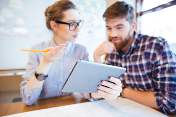 Business people working with tablet computer