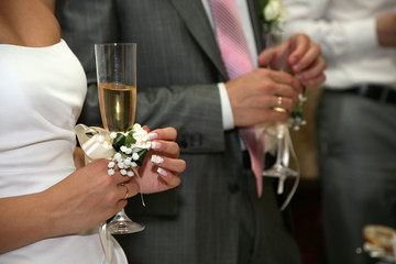 bride and groom holding glasses of champagne