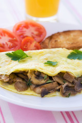 Folded mushrooms silky omelette with toast and tomatoes
