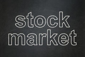 Finance concept: Stock Market on chalkboard background