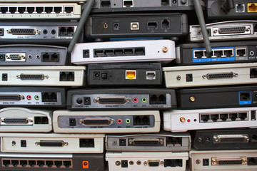 Old modems, routers, network equipment. Serial, phone, audio, ethernet connectors. - obrazy, fototapety, plakaty