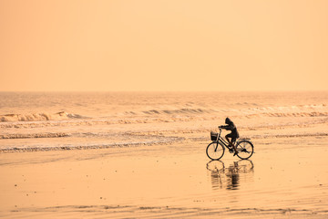 Kids with bike at the beach
