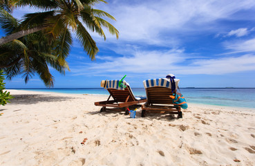 Two chairs on the tropical beach