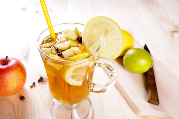 Grog with lime, lemon and apple