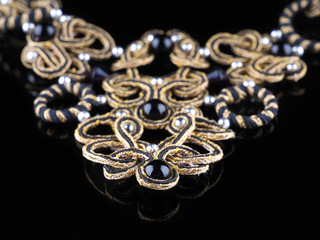 handmade necklaces on a black background