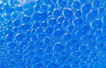 Air bubbles of water on a blue background.