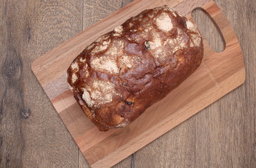 Sliced black bread on the wooden plank