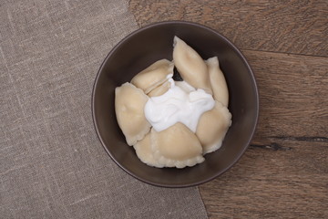 Vareniki on a wooden background