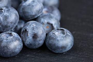 Ripe blueberries on slate