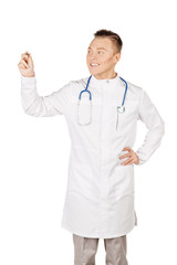 Young  male doctor in white coat writing on blank glass board or