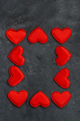 black background with frames of red hearts, vertical
