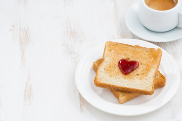 toast with jam in the shape of a heart and coffee 