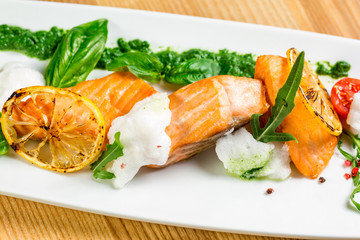 Salmon Steak with Grilled Vegetables, White Sauce and Lime