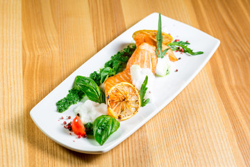 Salmon Steak with Grilled Vegetables, White Sauce and Lime