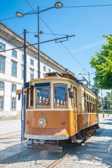 Fototapeta na wymiar Historical tram in Porto, Portugal in a summer day