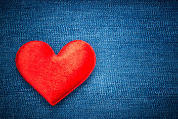 Red heart shape on vintage background denim