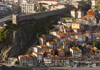 Fototapeta na wymiar Outside the Wall. The historically poorer quarter of Porto lies just beyond the old city walls. The buildings cascade down the steep sides of the river valley.