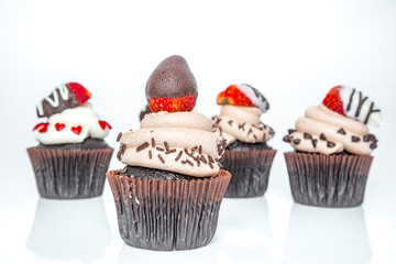 Chocolate Cupcakes on white background (Selective Focus)