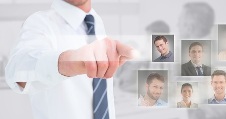 Composite image of businessman in shirt presenting at camera 