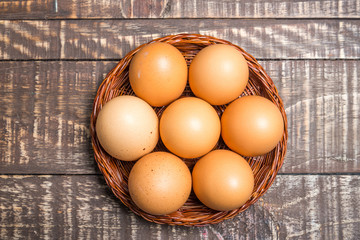 Frsh eggs on wood vintage background.