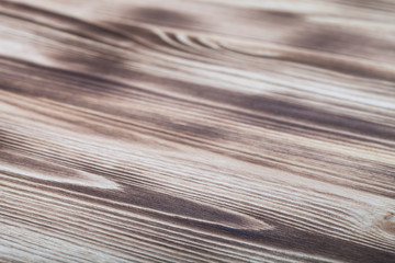 New light wooden burned background. Selective focus