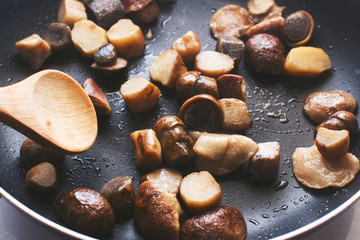 boletus mushrooms fried in a pan
