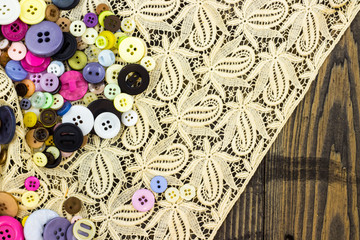 Naklejka premium Buttons on cream lace