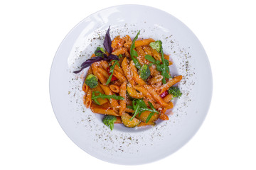 Red penne pasta with tomato sauce and vegetables, top view, isolated