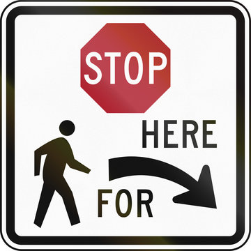 United States MUTCD regulatory road sign - Stop here for pedestrians