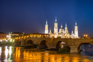 Our Lady of the Pillar Basilica with Ebro River at dusk Zaragoza