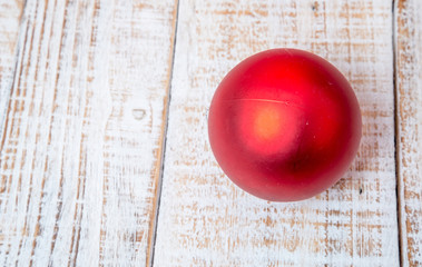 Christmas decorations and gift boxes on wooden board background