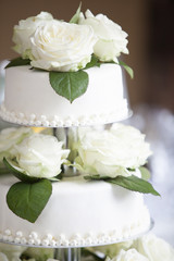 White wedding cake with roses