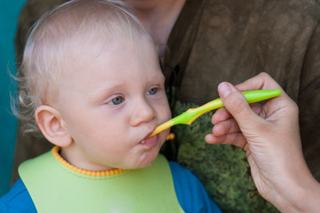Baby feeding from spoon