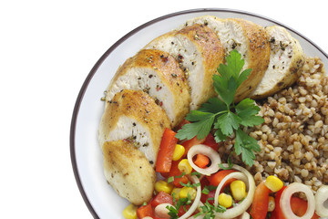Chicken breast, buckwheat and salad with paprika, onions and corn