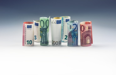 Obraz na płótnie Canvas Several hundred euro banknotes stacked by value. Euro money concept.
