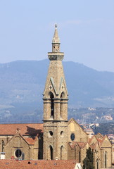 Fototapeta na wymiar Belfry of Holy Cross Basilica in Florence, Italy