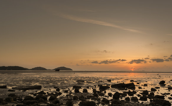 Fototapeta sunrise with clouds and siluate boat