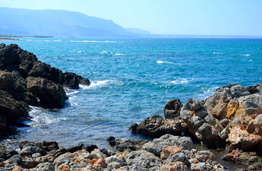 The shores of the Aegean Sea and mountains.