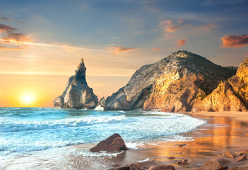 Fototapeta na wymiar Ocean Landscape at Sundown, big rocks and stones beach