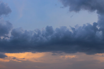 rain cloud on sunset sky background