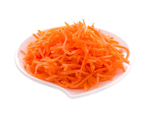Carrot on a white plate on a white background. Isolated object.
