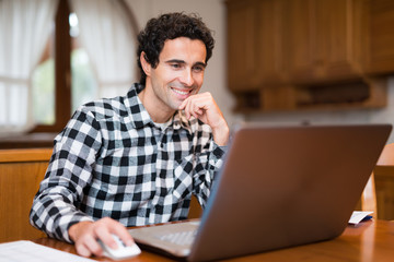 Man using his laptop at home