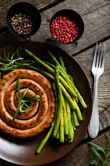 Grilled sausage with asparagus and rosemary