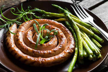 Grilled sausage with asparagus and rosemary