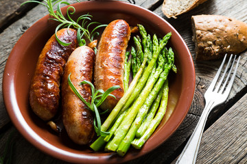 Grilled sausage with asparagus and rosemary